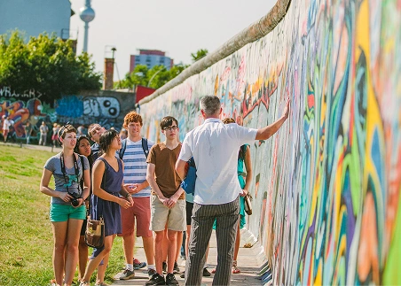 Trace the arc of the Cold War in Berlin through iconic sites like Checkpoint Charlie and the Berlin Wall, then deepen your understanding during a live panel
