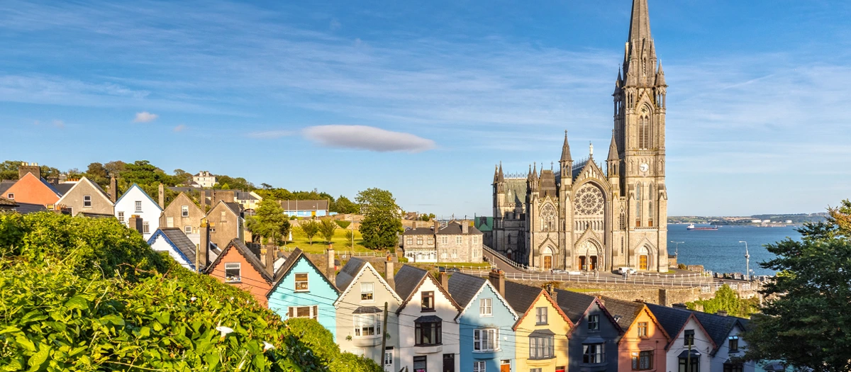 St Colman's Cathedral above the colourful houses of Cobh on Ireland, Scotland and England tours.