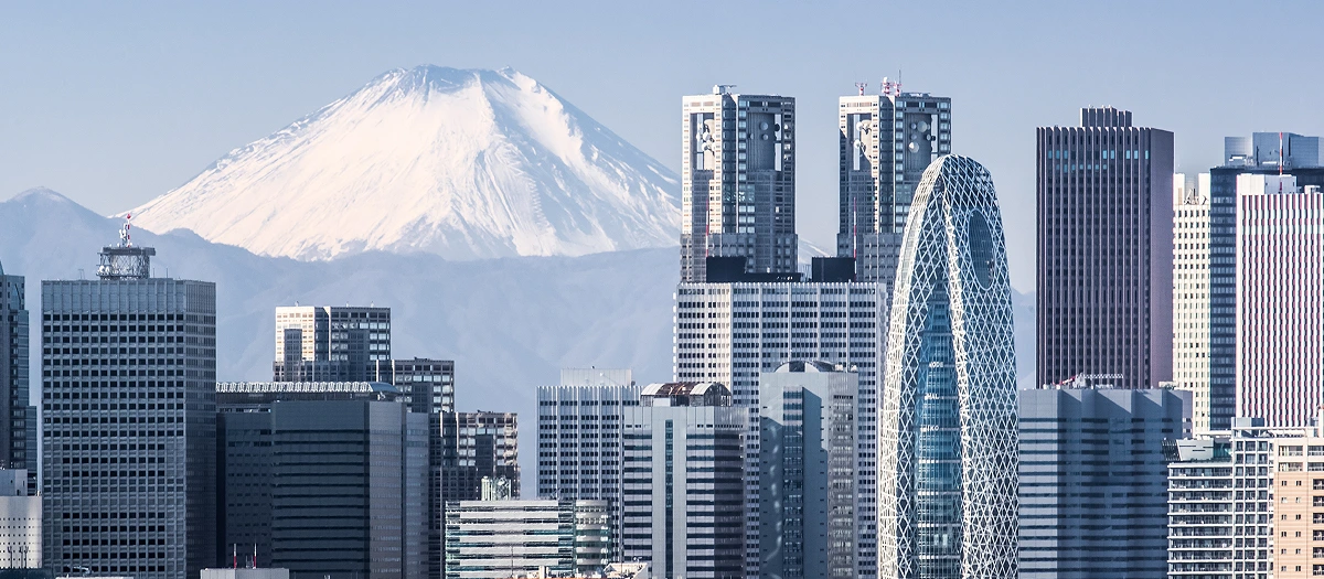 Tokyo skyscrapers with Mount Fuji rising behind them on a Japan STEM student tour.