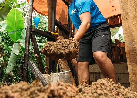 Work alongside community members on hands-on environmental projects, like planting, harvesting, and composting