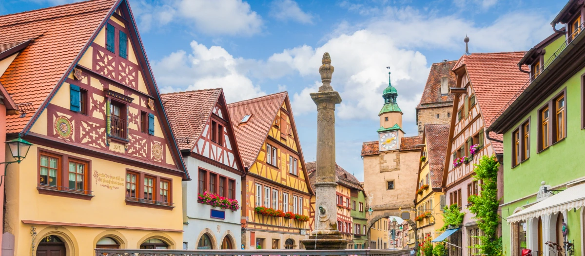 Half-timbered houses around a German market square on Germany, Italy and Switzerland tours.