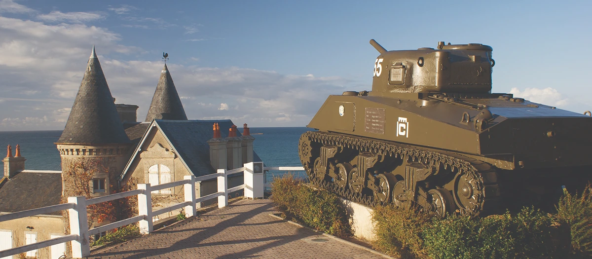 Sherman tank on a clifftop above the sea in Normandy on a WWII and the Western Front tour.