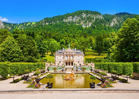 Visit Linderhof Palace to learn about King Ludwig’s life, explore the palace’s ornate rooms, and walk the beautiful gardens