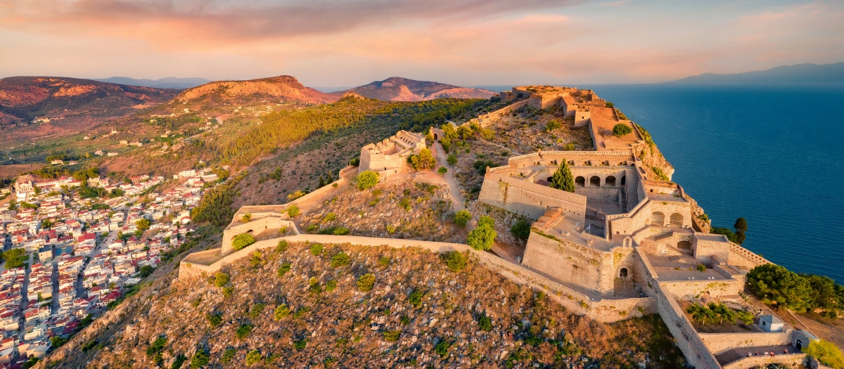Hilltop fortress above the sea and town in Greece on the Athens and Argolida student tour.