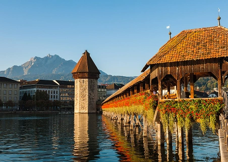 Cross Lucerne’s Kapellbrücke, Europe’s oldest wooden covered bridge, and take in views of the Alps and city’s historic center