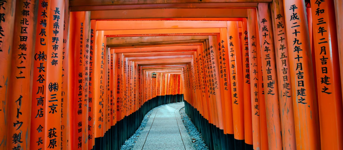 tori gates at fushimi inari shrine in kyoto japan