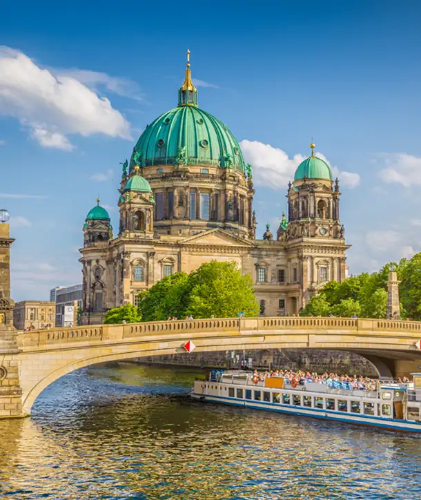 Bridge with old building in background with green roof seen on EF's German language immersion.