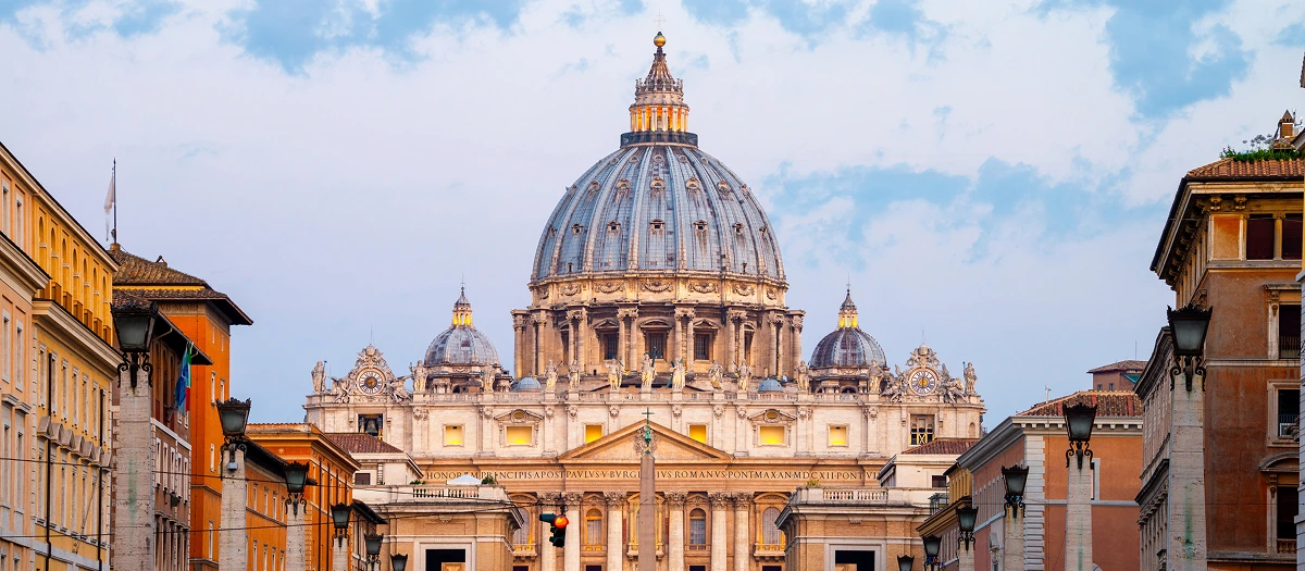 St Peter's Basilica dome above the streets of Rome on a London and Rome student trip.