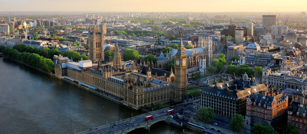 Houses of Parliament and Big Ben beside the Thames on a London, Paris and Rome trip.