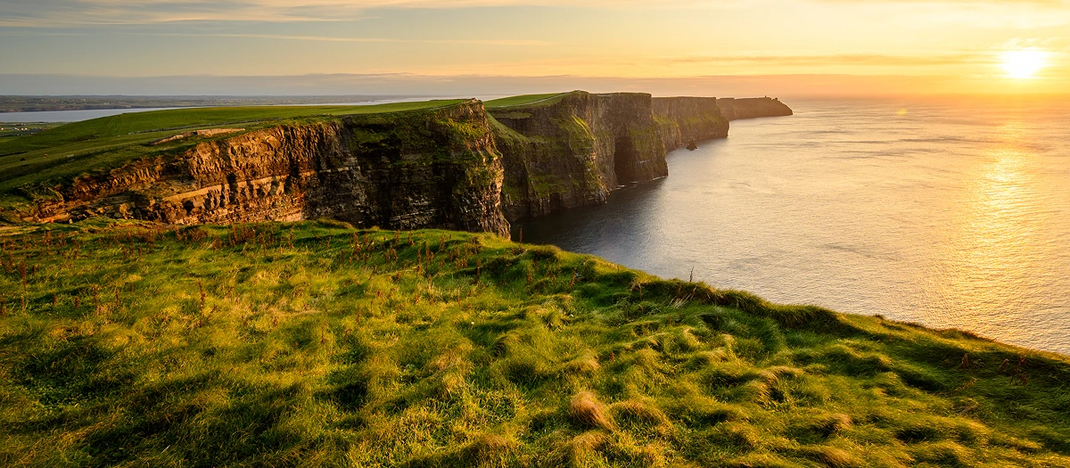 Cliffs of Moher above the Atlantic at sunset in Ireland on the Emerald Isle student tour.