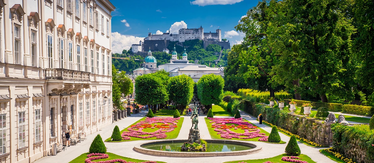 Salzburg's Mirabell Gardens below Hohensalzburg Fortress on Germany, Switzerland and Austria tours.