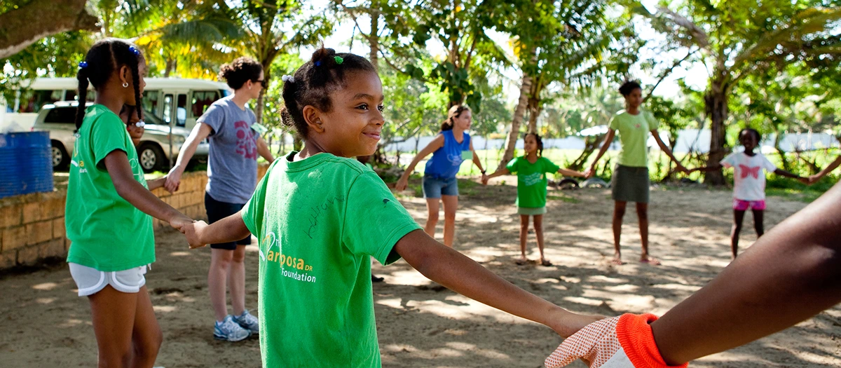 Students volunteering with children in the Dominican Republic.