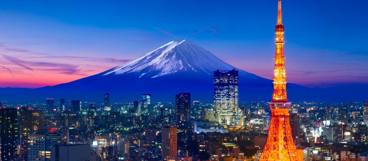 Tokyo Tower and Mount Fuji at dusk above the city skyline on Japan: Land of the Rising Sun.