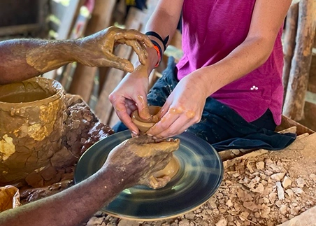 Craft a traditional faceless doll in a pottery workshop led by a local Dominican artist