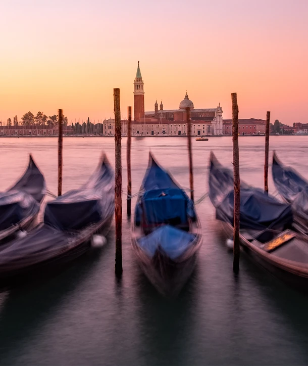 Close-up view of five boats docked on trip to Venice, Florence & Rome.