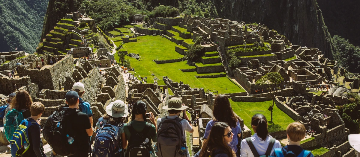 Students gazing out over the ruins of Machu Picchu in Peru.