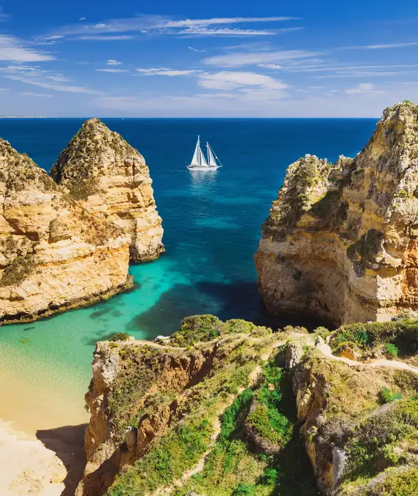 EF Discover Portugal tour looks like this: blue-green water with sailboat in back.