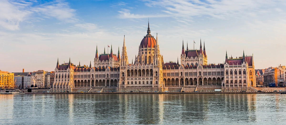 Hungarian Parliament reflected in the Danube on Budapest, Vienna and Prague student tours.