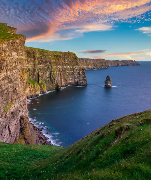 Sunset at the Cliffs of Moher on an Emerald Isle Ireland tour.