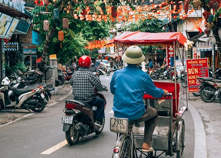 Zip through Hanoi’s Old Quarter by rickshaw, observing the city’s French colonial architecture, famous landmarks, and busy street life