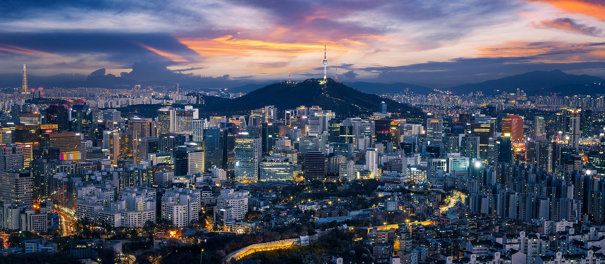 Seoul city lights at dusk below N Seoul Tower on Namsan mountain in South Korea.