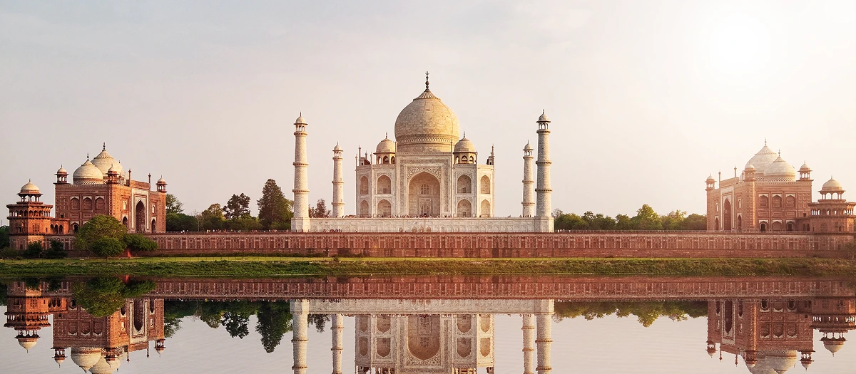 Taj Mahal reflected in still water in Agra on an India Golden Triangle school trip.