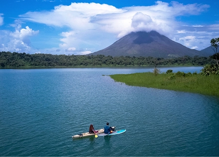Kayak across Lake Arenal and admire views of the towering Arenal Volcano