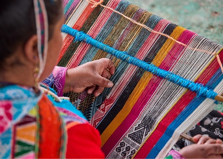 Enjoy a traditional weaving demonstration in a small Sacred Valley community