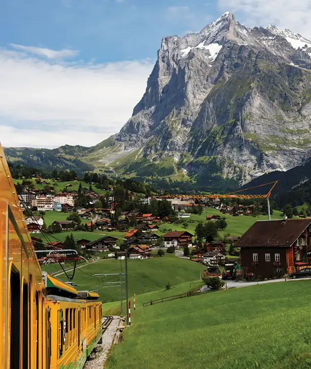 Spectacular Alpine mountains of Lucerne overlooking a train on EF's Germany, Austria & Switzerland tour.