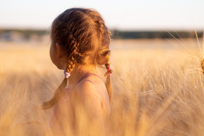 young girl staring into distance