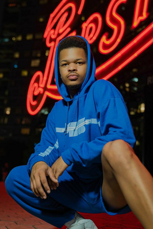 Fabron Alexis in a blue hoodie