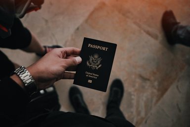 person holding USA passport