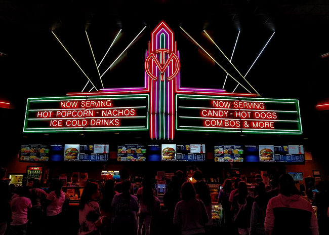 neon movie theatre sign