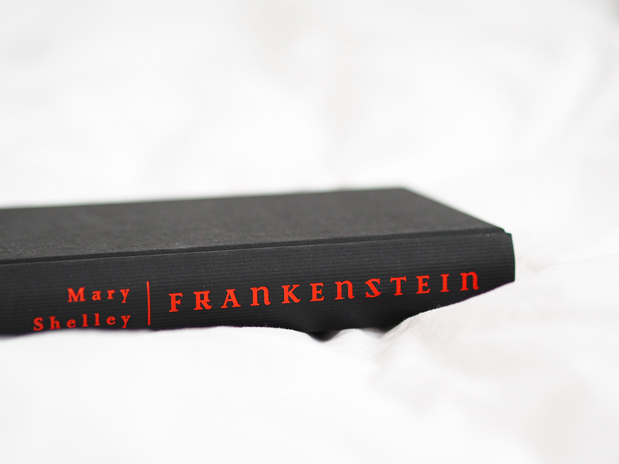 black Frankenstein book in a white sheet by Laura Chouette on Unsplash