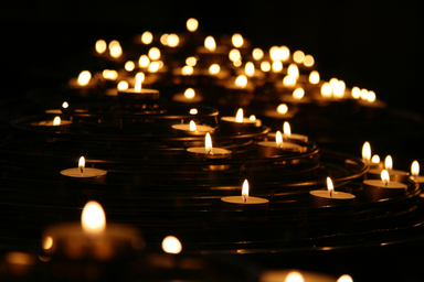 \"photo of lightened candles\" on Unsplash