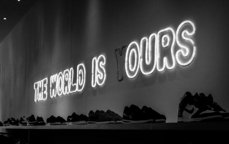 the world is ours neon sign