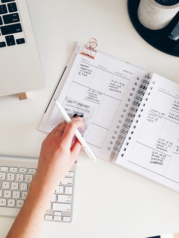 Writing in Planner by STIL distributed by Unsplash