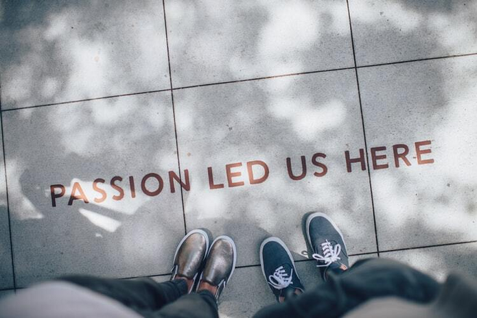 \"passion led us here\" written on the floor