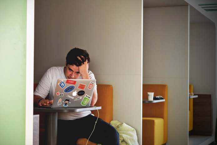 guy doing homework stressedjpg by Tim Gouw from Unsplash