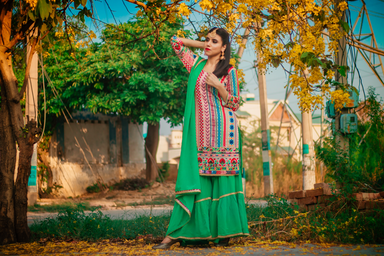 Punjabi woman wearing green attire outdoors