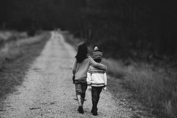 two kids walking together by Annie Spratt via Unsplash