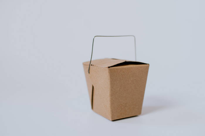 cardboard takeout container by Kelly Sikkema via Unsplash