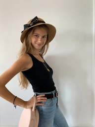 Gril posing in a hat