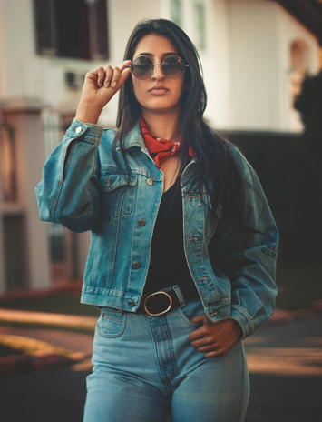 woman wearing denim jacket and jeans