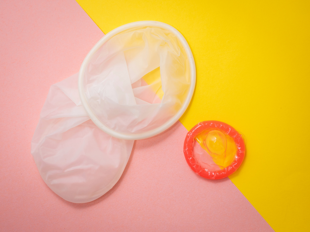 male condom beside female condom