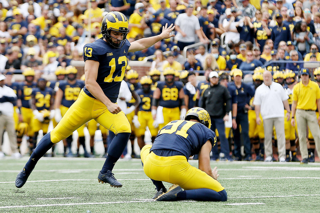A photograph of Jake Moody at kickoff at a University of Michigan football game