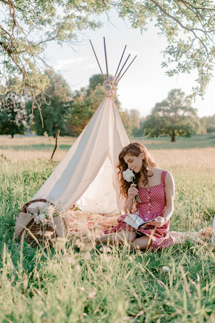 Girl reading at a picnic