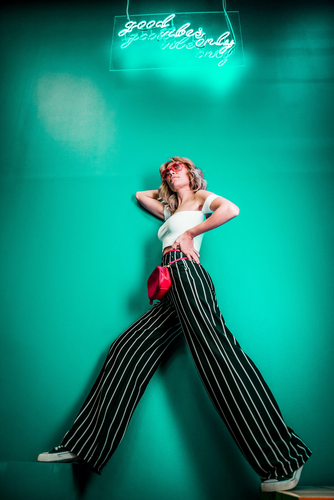 posing woman with wide-leg pants