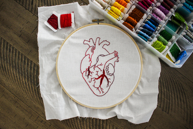 embroidered heart with red thread
