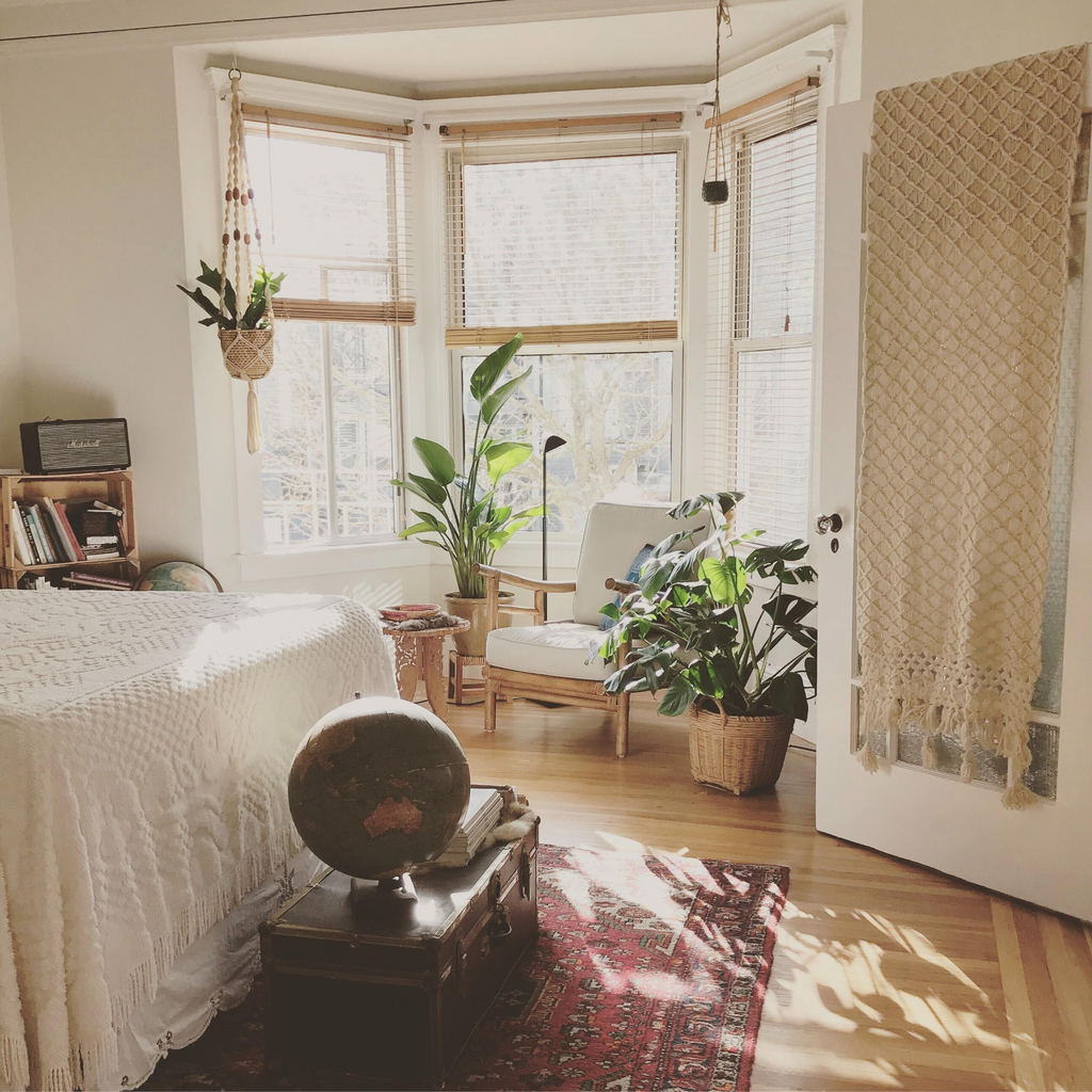 boho bedroom with plants and macrame